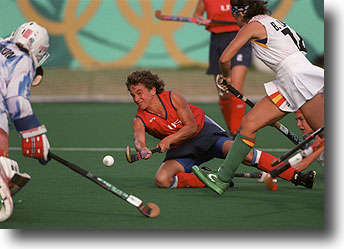 Tracey Fuchs of the United States, center, attempts a shot on the Spanish goal during their women's Olympic hockey game Tuesday July 30, 1996 at the Centennial Summer Games in Atlanta.